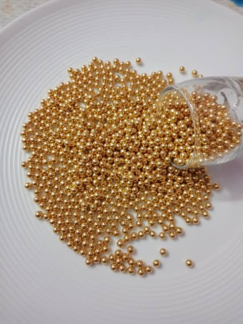 ২মি.মি. গোল্ডেন সুগারবল।  2mm golden sugarball.